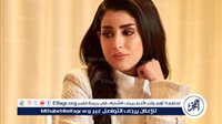أيتن عامر تتألق بإطلالة ساحرة بفستان لبني يبرز رشاقتها وأناقتها